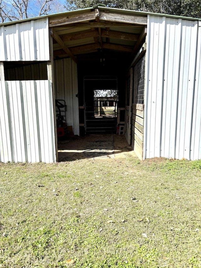 view of outdoor structure featuring a yard