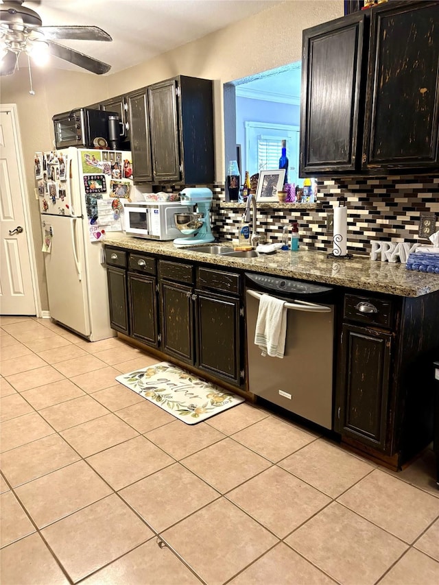 kitchen featuring tasteful backsplash, ceiling fan, light tile patterned floors, and white appliances