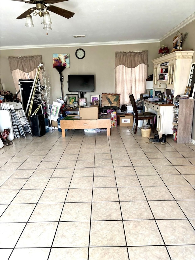 living room with light tile patterned flooring, ornamental molding, and ceiling fan