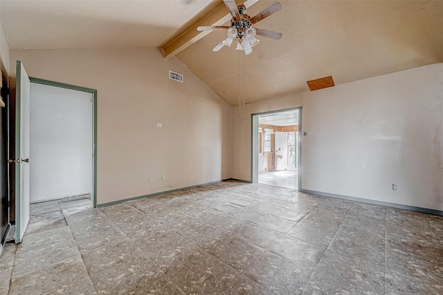 empty room featuring ceiling fan and vaulted ceiling with beams