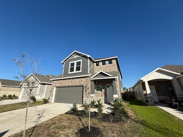 craftsman inspired home with a garage and a front lawn