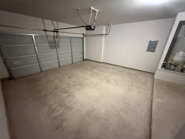 garage featuring a garage door opener and electric panel