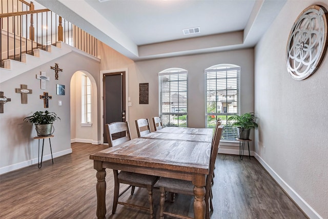 dining space featuring dark hardwood / wood-style flooring