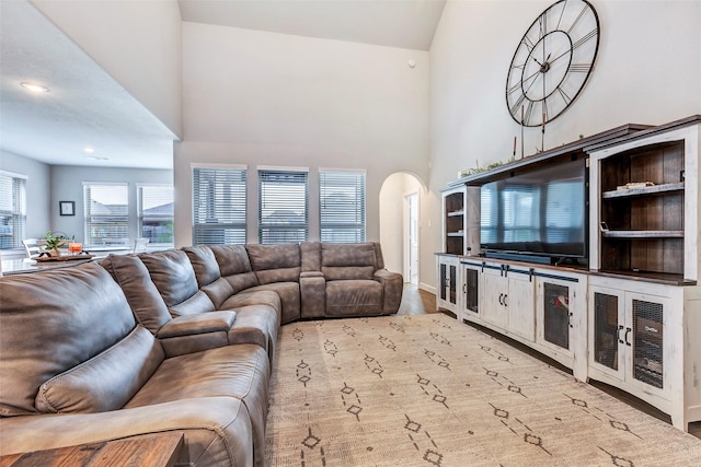 living room with a towering ceiling