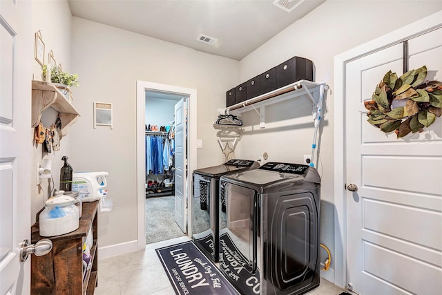 washroom featuring light tile patterned flooring and independent washer and dryer