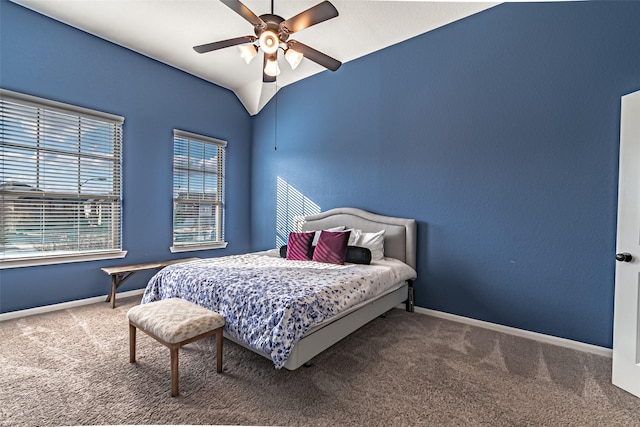 carpeted bedroom with vaulted ceiling and ceiling fan