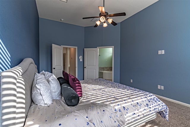 bedroom with light colored carpet, ceiling fan, and ensuite bathroom