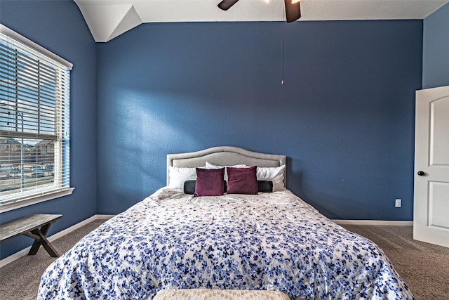 carpeted bedroom featuring ceiling fan and vaulted ceiling