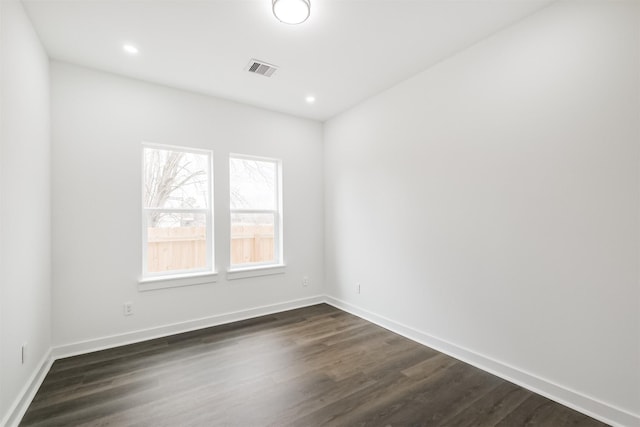 empty room with dark wood-type flooring