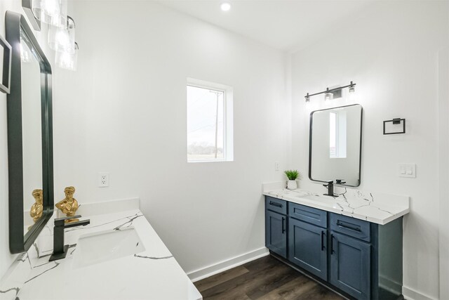 bathroom featuring vanity and hardwood / wood-style floors