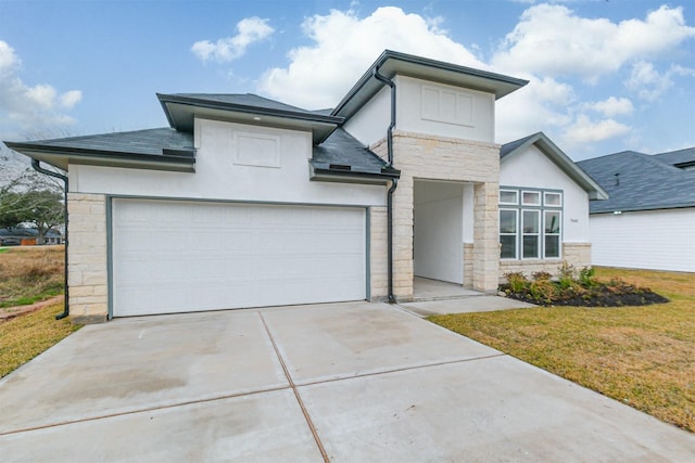 view of front of home featuring a garage and a front yard