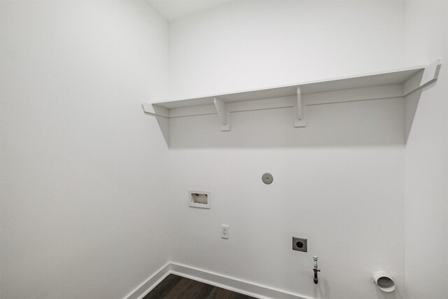 laundry area with gas dryer hookup, hookup for a washing machine, dark hardwood / wood-style flooring, and electric dryer hookup