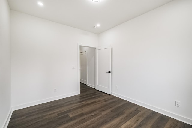 spare room featuring dark hardwood / wood-style flooring