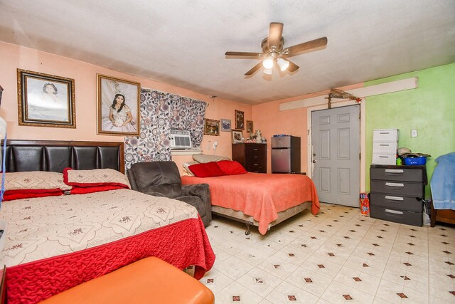 bedroom with stainless steel refrigerator, ceiling fan, and cooling unit