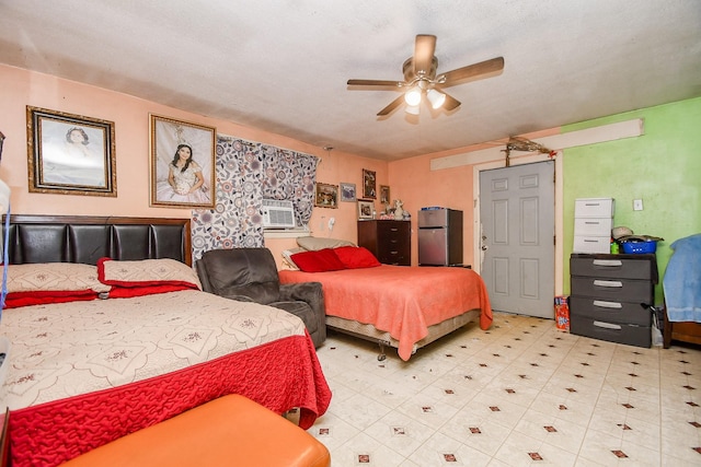 bedroom featuring cooling unit, ceiling fan, and stainless steel fridge