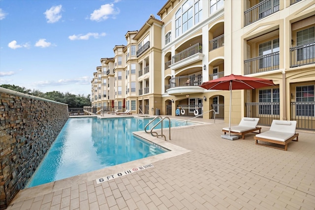 view of swimming pool with a patio area