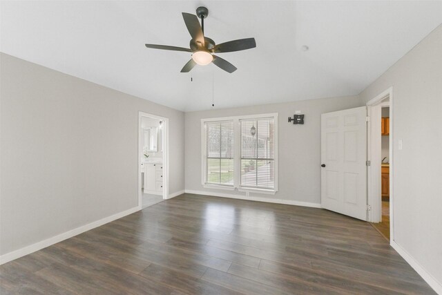 unfurnished room featuring lofted ceiling, dark wood-type flooring, and ceiling fan