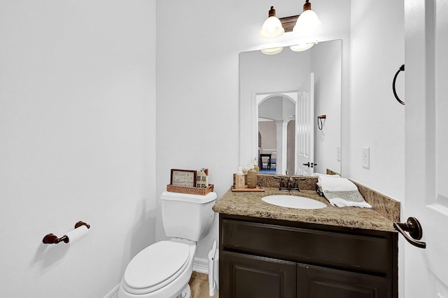 bathroom with vanity and toilet