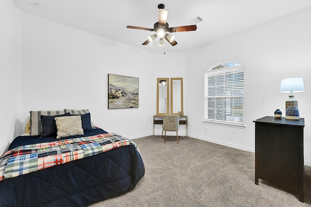 bedroom featuring light colored carpet and ceiling fan