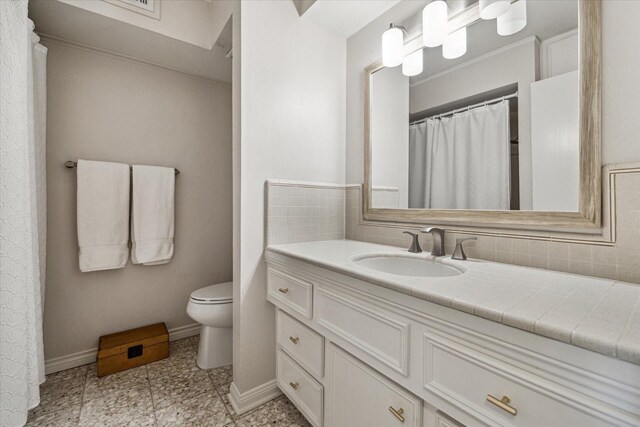 7533 Del Monte Dr, Houston, TX 77063 - bathroom featuring toilet, vanity, and baseboards
