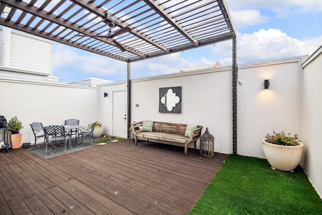 deck with an outdoor hangout area and a pergola