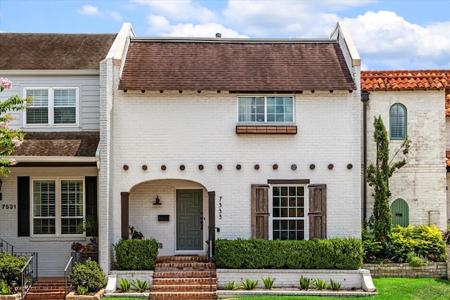 7533 Del Monte Dr, Houston, TX 77063 - view of front facade with brick siding and a shingled roof