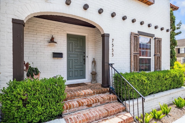 7533 Del Monte Dr, Houston, TX 77063 - doorway to property featuring brick siding