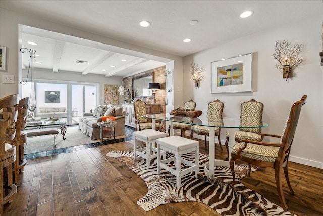 dining room with beamed ceiling and dark hardwood / wood-style flooring