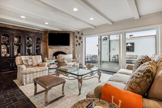7533 Del Monte Dr, Houston, TX 77063 - living area with beamed ceiling, recessed lighting, a brick fireplace, and brick floor
