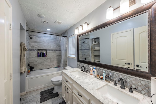 full bathroom with toilet, tasteful backsplash, a textured ceiling, vanity, and shower / bath combo with shower curtain