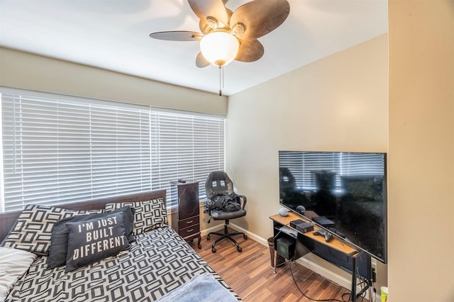 bedroom featuring hardwood / wood-style flooring and ceiling fan