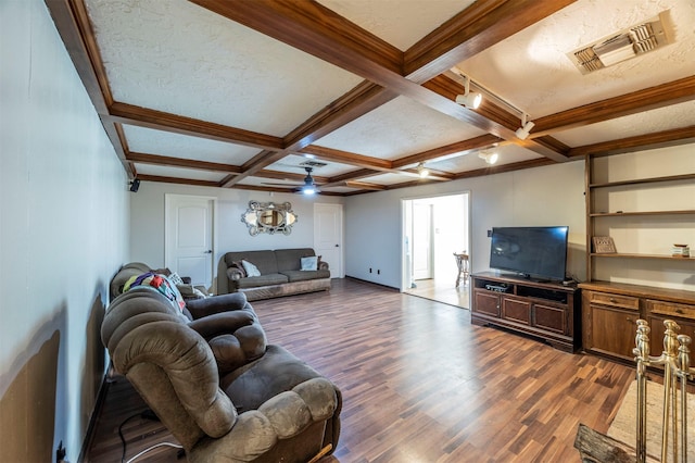 living room featuring coffered ceiling, dark hardwood / wood-style flooring, and beam ceiling