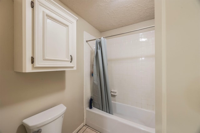 bathroom with toilet, shower / bath combination with curtain, and a textured ceiling