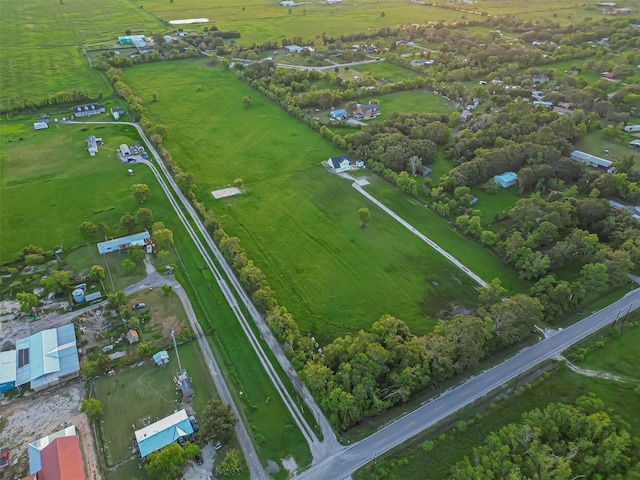 birds eye view of property featuring a rural view