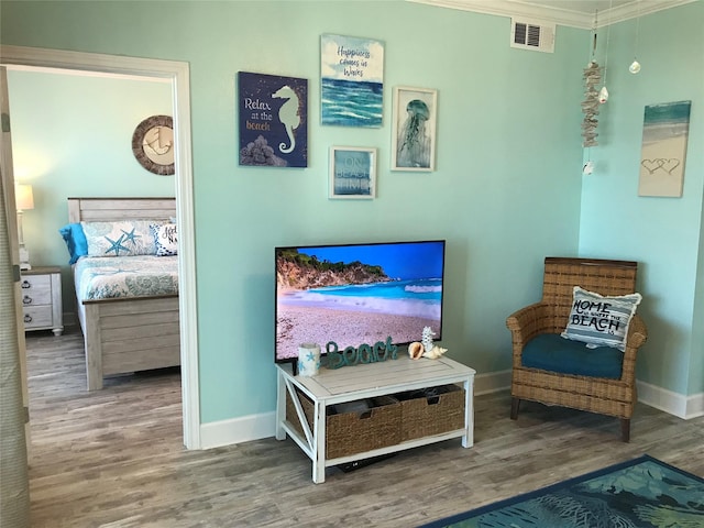 living area with hardwood / wood-style flooring