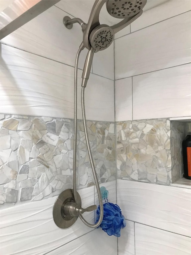 details with a tile shower