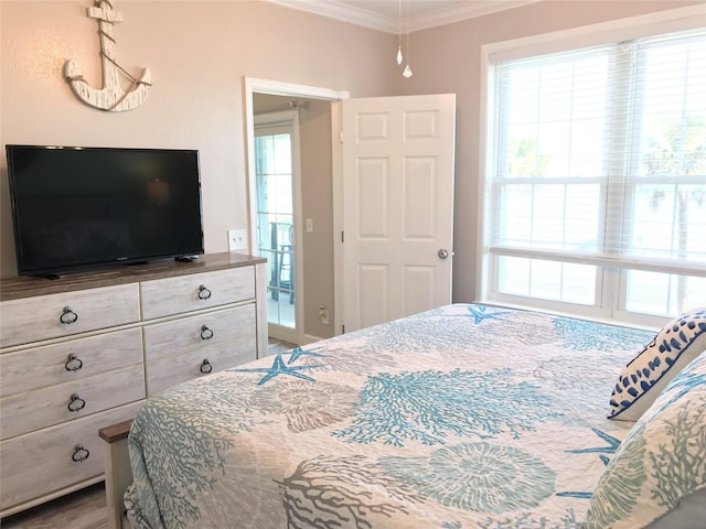 bedroom with multiple windows and ornamental molding