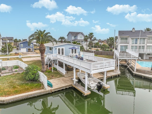 view of dock with a deck with water view