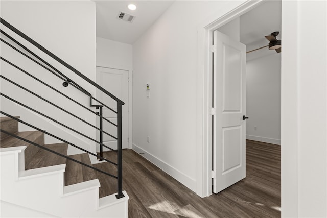 stairs featuring hardwood / wood-style flooring