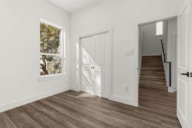 interior space with dark hardwood / wood-style floors