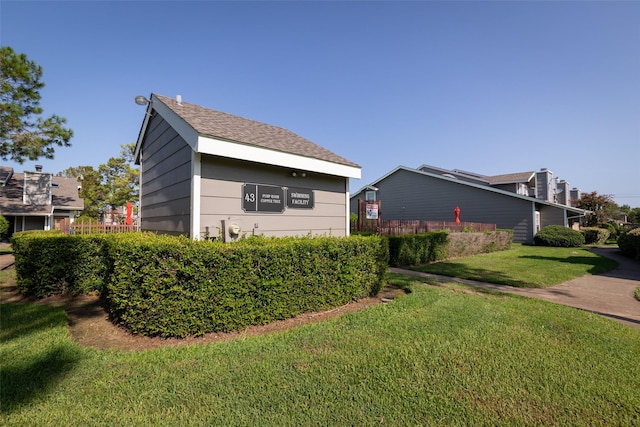 view of property exterior with a lawn