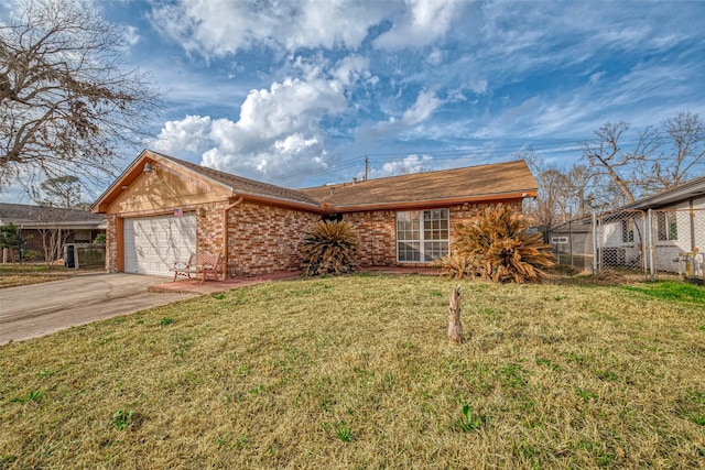 view of front of property with a garage and a front yard