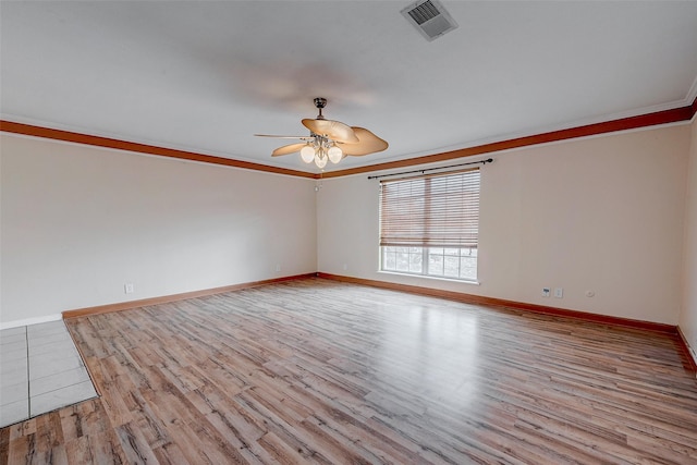 unfurnished room with ornamental molding, ceiling fan, and light hardwood / wood-style flooring