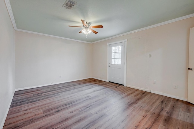 unfurnished room with crown molding, light hardwood / wood-style flooring, and ceiling fan