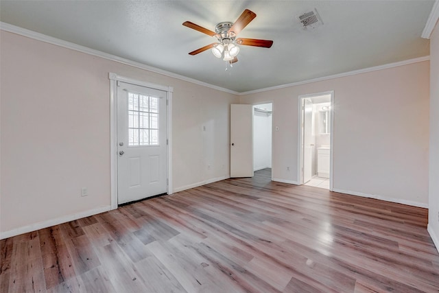 unfurnished room featuring crown molding, ceiling fan, and light wood-type flooring