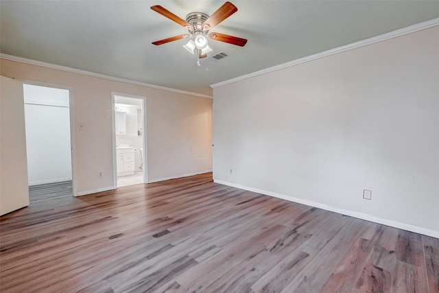 empty room with ceiling fan, ornamental molding, and light wood-type flooring