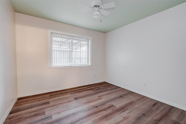 spare room featuring ceiling fan and light hardwood / wood-style floors