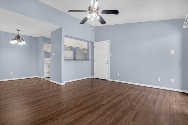 unfurnished living room with ceiling fan with notable chandelier, vaulted ceiling, and dark hardwood / wood-style floors