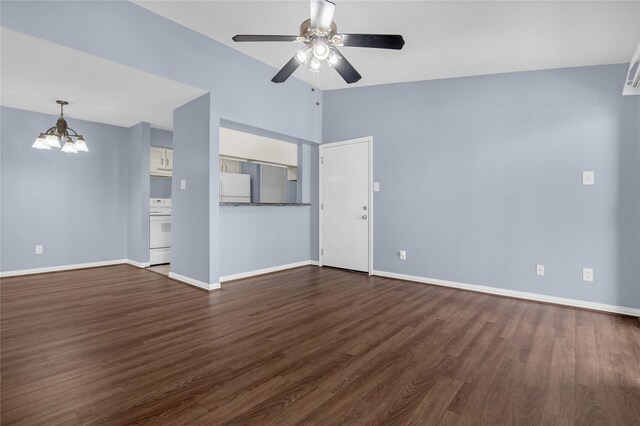 unfurnished living room with a chandelier, a ceiling fan, dark wood-style flooring, baseboards, and vaulted ceiling