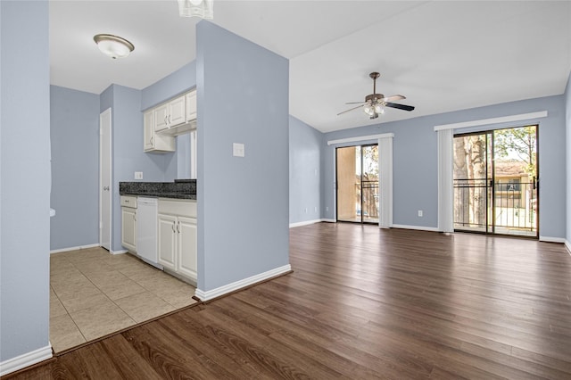 kitchen featuring ceiling fan, dishwasher, white cabinets, and light wood-type flooring